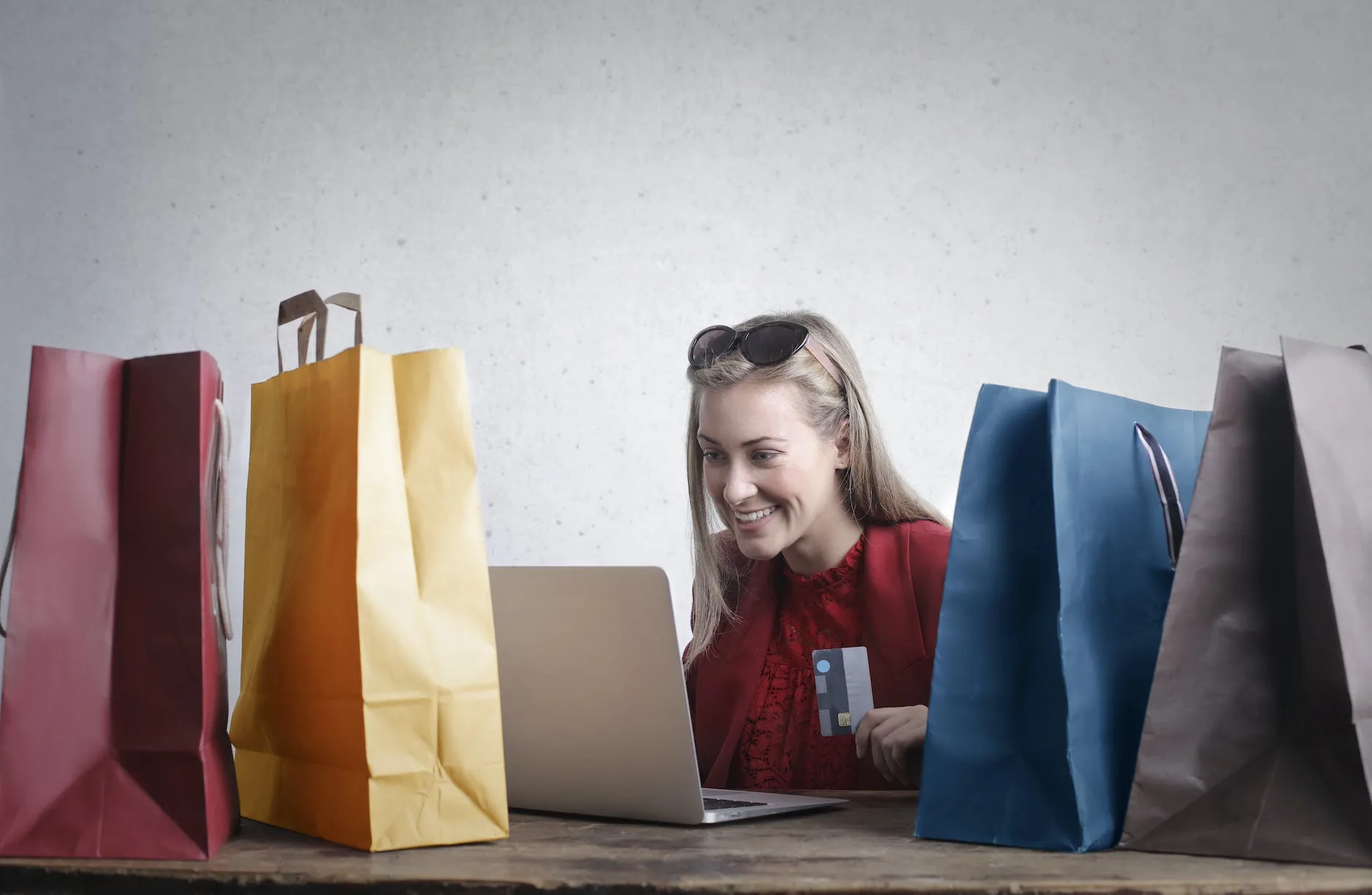 6 Best Jobs That Allow You to Travel Abroad 9 happy woman shopping online at home