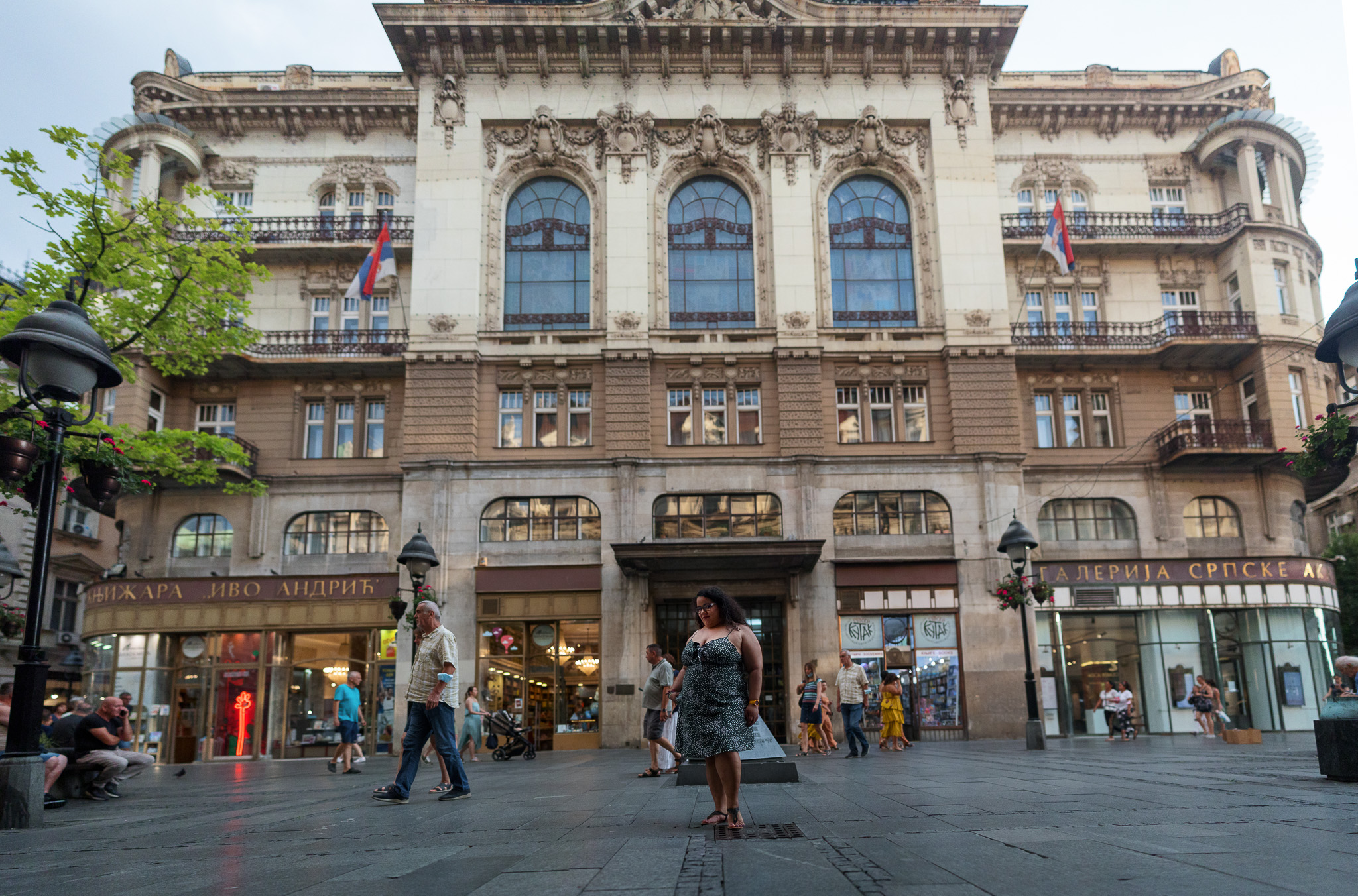 Brenda is traveling in Serbia, exploring things to do in Belgrade standing in front of a building in Knez Mihajlova St.