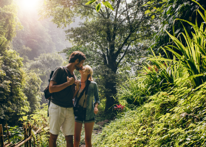 two backpackers kissing while hiking, which might lead to sex while backpacking