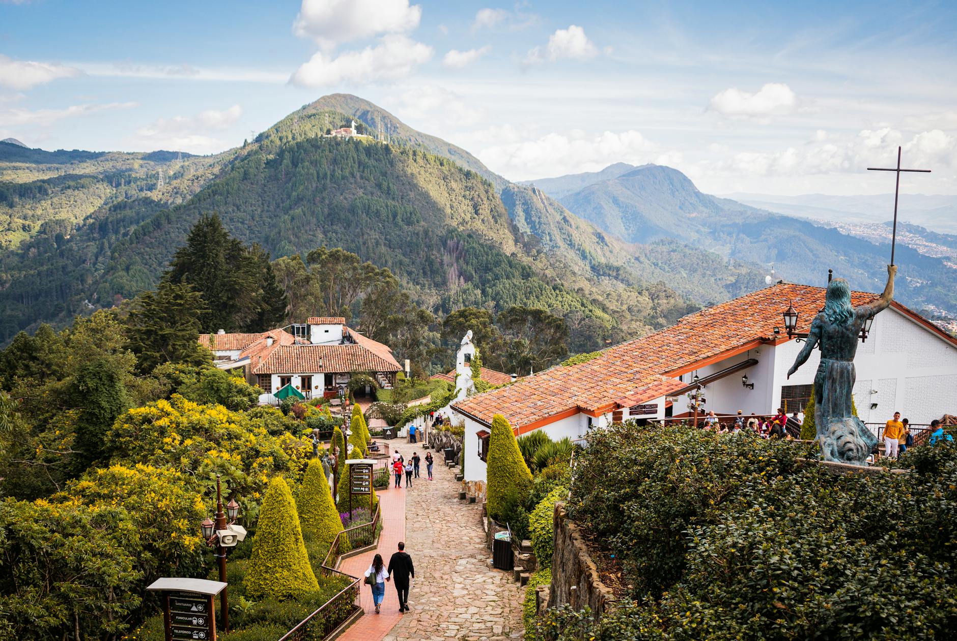 Que Ver En Bogotá en 2026: Guía Para Viajar Sola a Colombia 3 people walking on the street