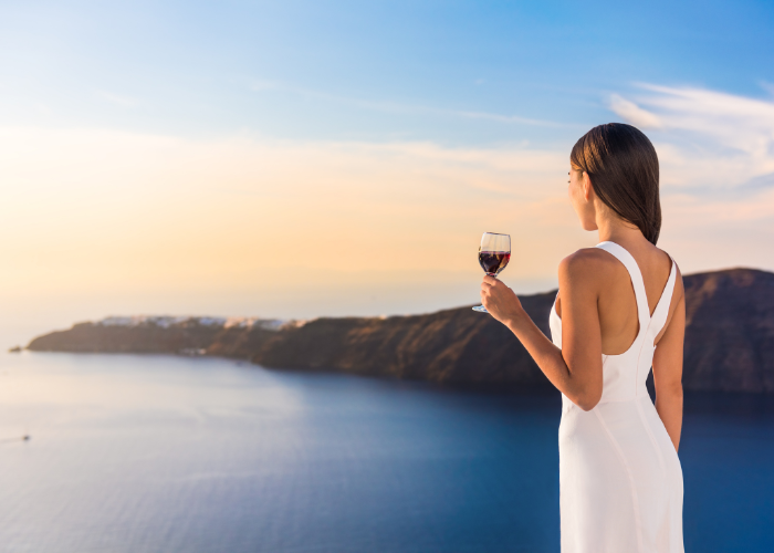 woman tasting wine in Greece
