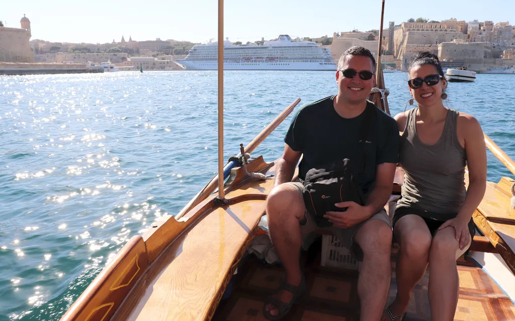 Robyn with her significant other in a boat in Malta