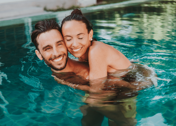 A couple in the pool in an adults only resort