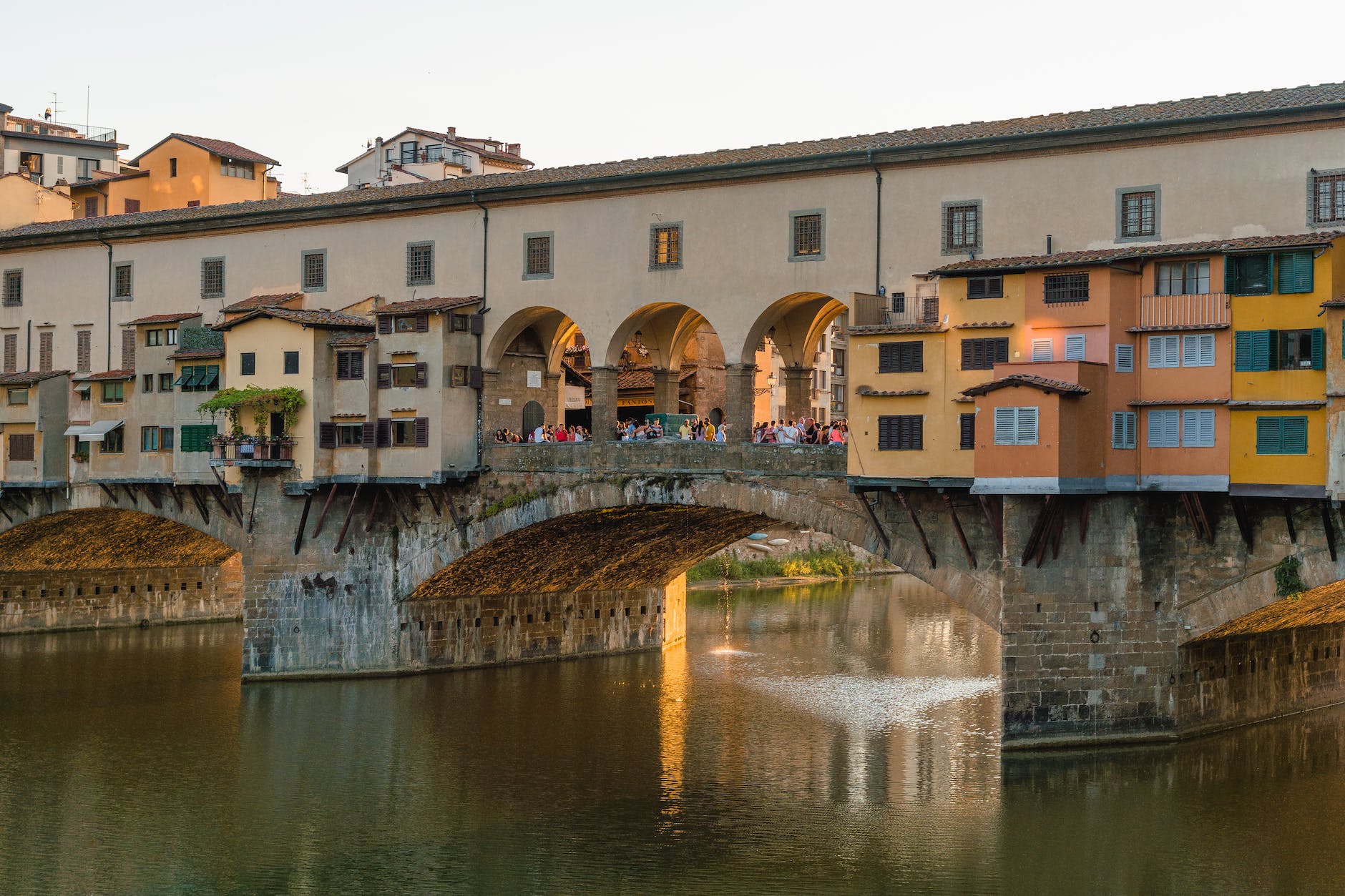 Two Weeks In Italy Itinerary: Best Italy Itinerary 14 Days 9 houses beside body of water in Ponte Vecchio, Florence