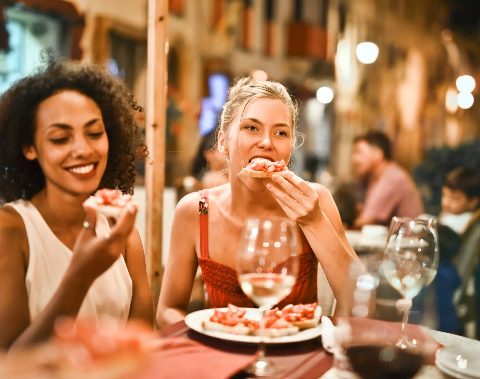 29 Things Not to Do in Italy: Avoid These Mistakes 20 woman eating bruschetta in Italy