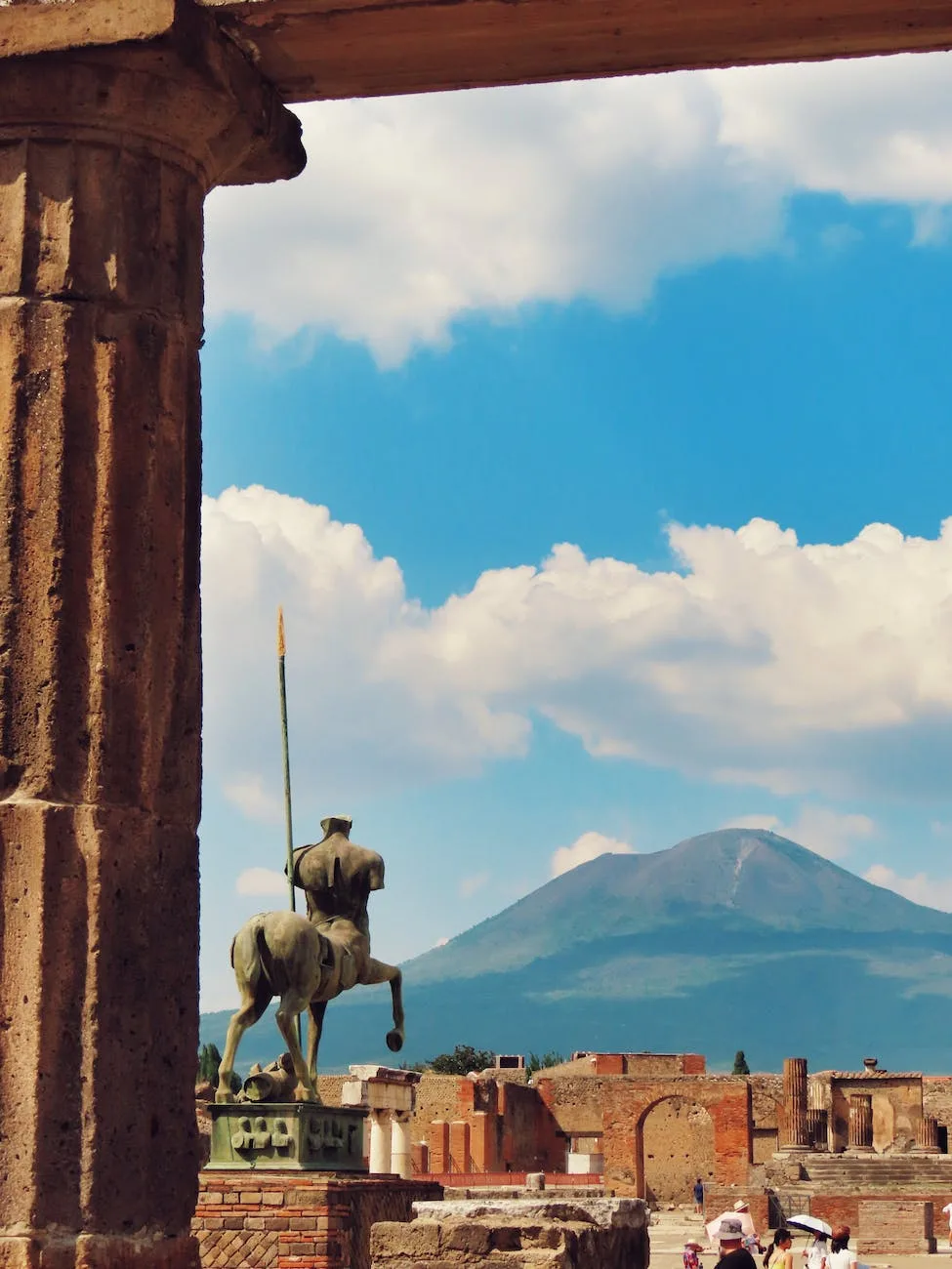 Two Weeks In Italy Itinerary: Best Italy Itinerary 14 Days 21 a statue of a horse and rider in front of a mountain in Pompeii