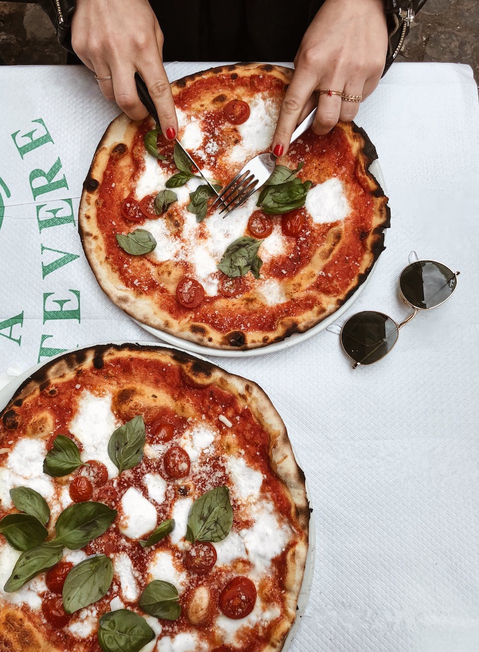 29 Things Not to Do in Italy: Avoid These Mistakes 9 person slicing pizza in Italy