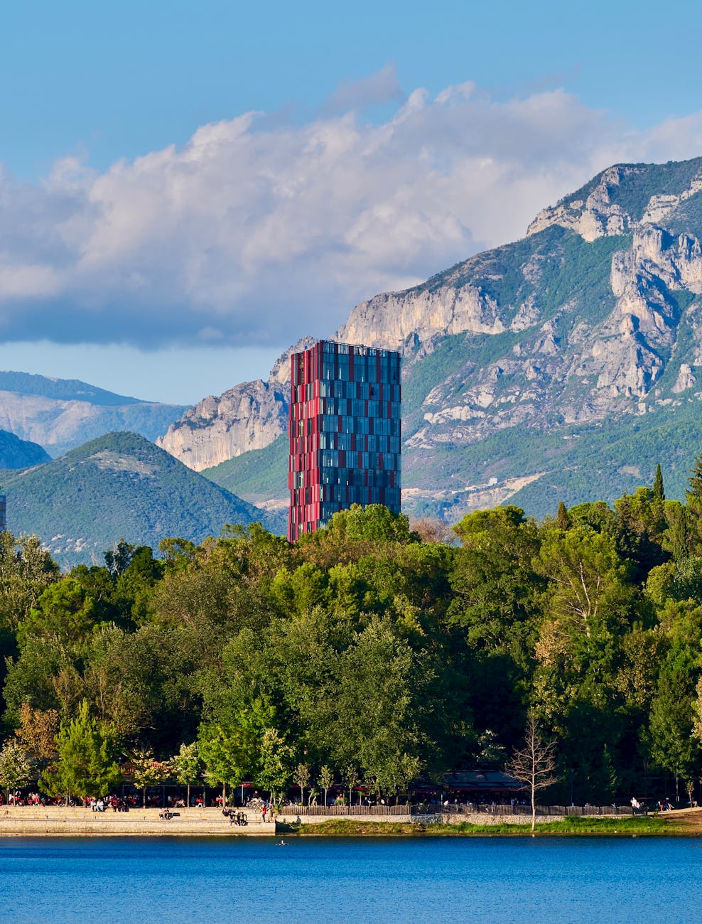 view of the tirana marriott above the trees and on the background of mountains tirana albania
