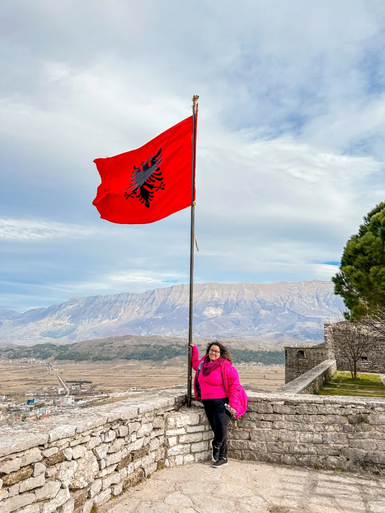 Brenda holding the Albanian flag in the Gjrokaster Castle