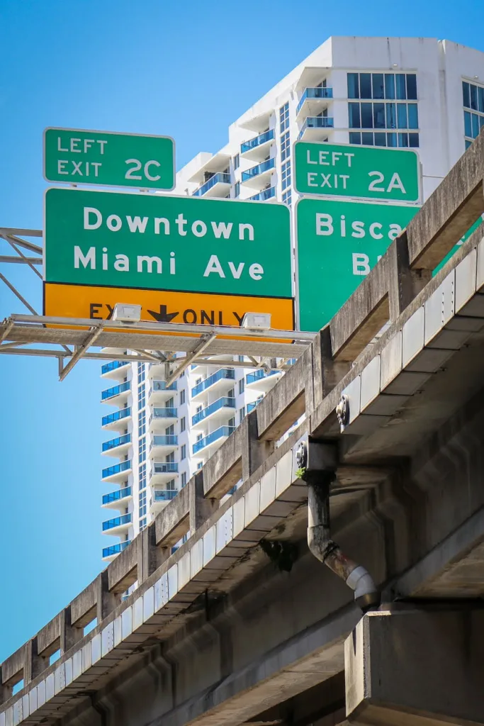 Solo Female Travel to Miami Comprehensive Guide 2026 7 green and white street sign on the bridge