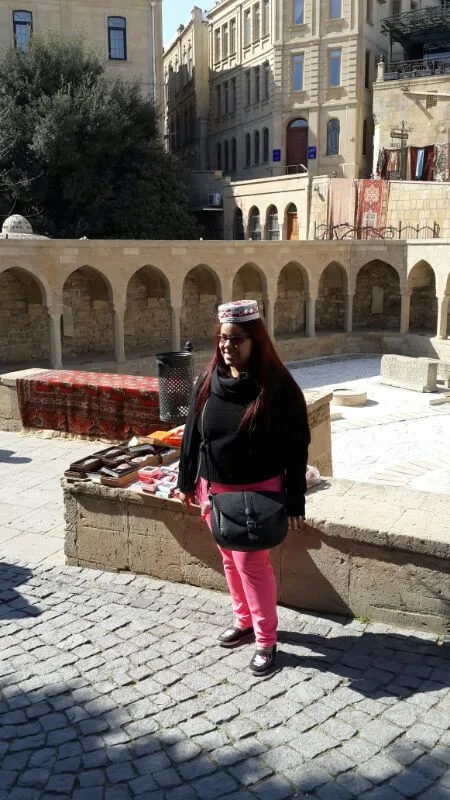 Azerbaijan Solo Female Travel Comprehensive Guide 2026 3 Brenda wearing a hat in Baku Old City