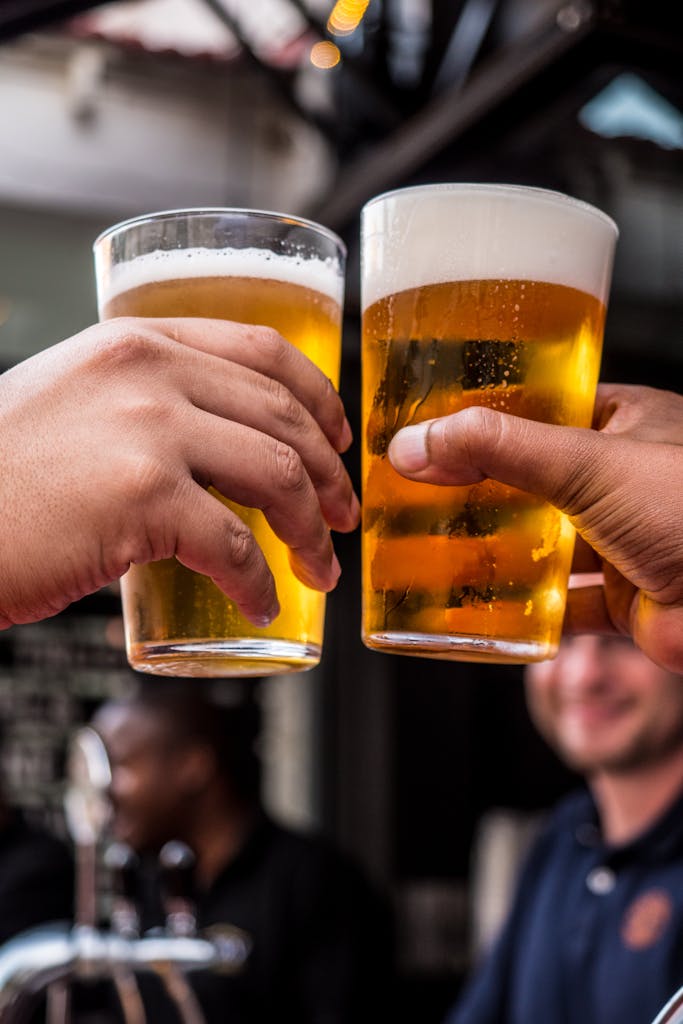 Best Tours in Puerto Rico in 2026 According to a Local 11 Two Persons Holding Drinking Glasses Filled With Beer