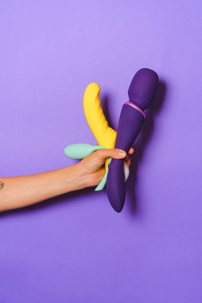 How to Travel With Sex Toys: Comprehensive Guide 2026 1 hand holding sex toys