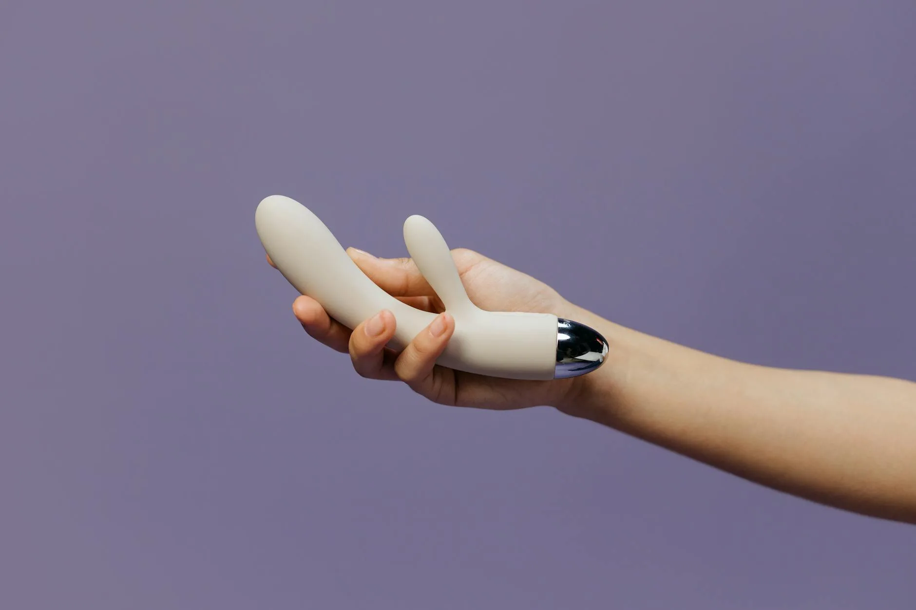 How to Travel With Sex Toys: Comprehensive Guide 2026 5 a person holding a rabbit vibrator