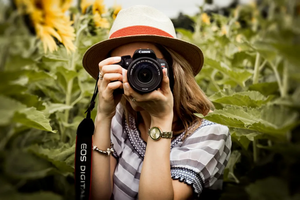 How to Keep Your Travel Photos Organized in 2026 1 selective focus photography of woman holding dslr camera