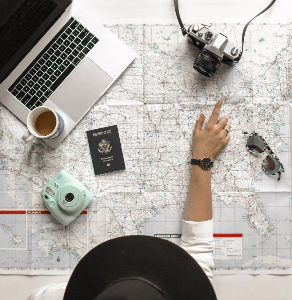 How to Plan a Road Trip: Best Tips in 2026 1 person pointing a location on the map